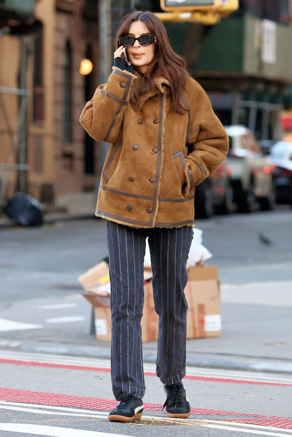 Emily Ratajkowski walks home wearing a Sandro shearling coat and pinstripe pants with Puma sneakers in New York City Pictured: Emily Ratajkowski Ref: SPL10670215 120124 NON-EXCLUSIVE Picture by: Christopher Peterson / SplashNews.com Splash News and Pictures USA: 310-525-5808 UK: 020 8126 1009 eamteam@shutterstock.com World Rights,